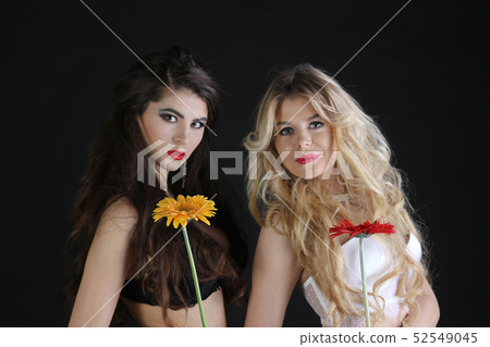 Two hot sexy female in lingerie with flowers Two hot sexy female in lingerie with flowers 52549045