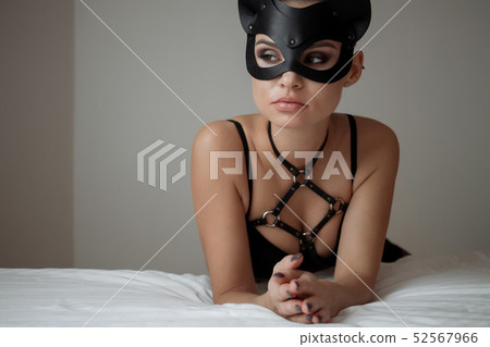 Brunette girl in a cat mask Brunette girl in a cat mask 52567966