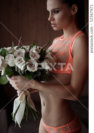 Young sensual naked woman posing on settee Young sensual naked woman posing on settee 52567971