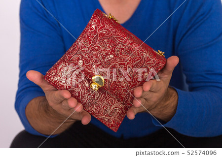 Strong male hands holding handbags 52574096
