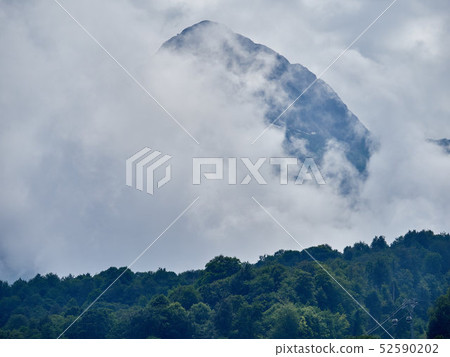 Green mountain slope with cable cars Green mountain slope with cable cars 52590202