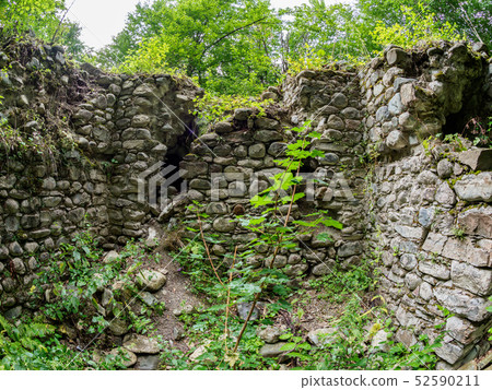 The ruins of an ancient stone fortress 52590211