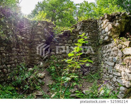 The ruins of an ancient stone fortress 52590214