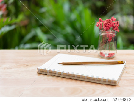 Notebook,brown pencil and beautiful red dried 52594830