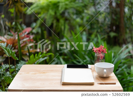 Workspace outdoors with memo notebook,pencil,white Workspace outdoors with memo notebook,pencil,white 52602569