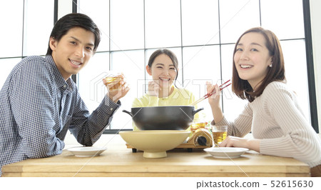 Image of women and men enjoying a party Image of women and men enjoying a party 52615630