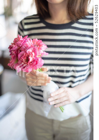Woman with a bouquet Woman with a bouquet 52629403