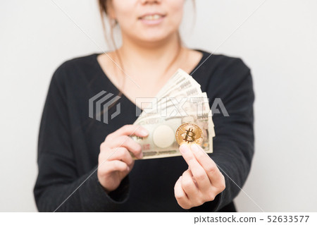 Woman with bitcoin and cash Woman with bitcoin and cash 52633577