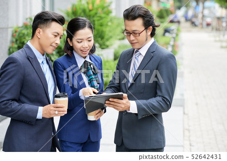 People using digital tablet for online conversation 52642431