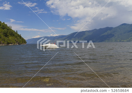 The shore of Lake Teletskoye in Altai The shore of Lake Teletskoye in Altai 52658684