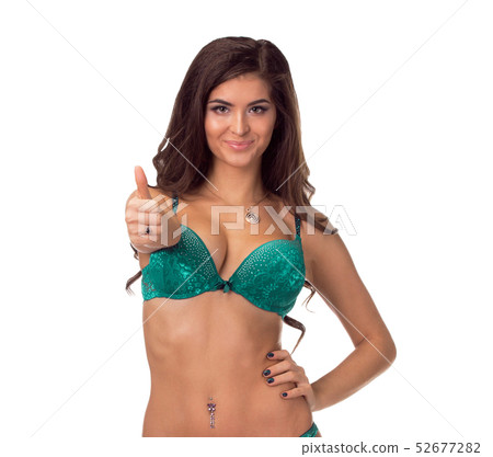 Young sexy woman in black undies gesturing OK signal, isolated image. Young sexy woman in black undies gesturing OK signal, isolated image. 52677282