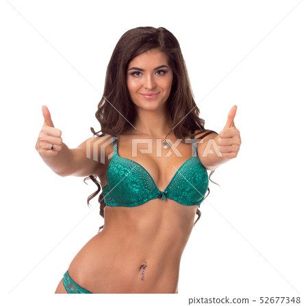 Young sexy woman in black undies gesturing OK signal, isolated image. Young sexy woman in black undies gesturing OK signal, isolated image. 52677348