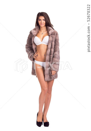 Full length portrait of beautiful brunette women in short mink coat. Isolated on white background 52678322