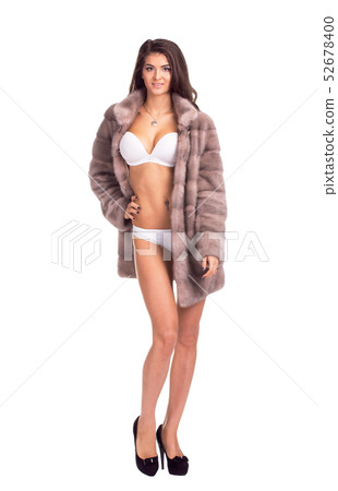 Full length portrait of beautiful brunette women in short mink coat. Isolated on white background 52678400