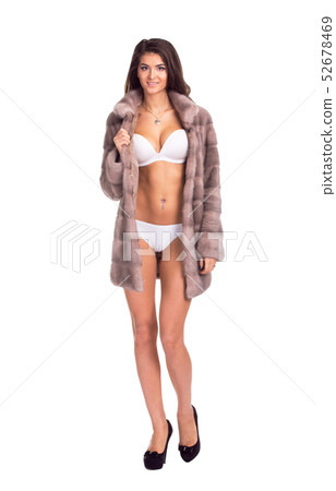 Full length portrait of beautiful brunette women in short mink coat. Isolated on white background 52678469
