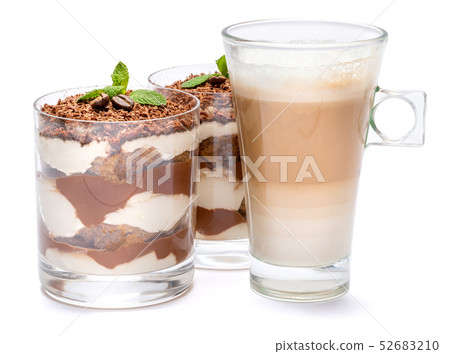 Classic tiramisu dessert in a glass and cup of coffee isolated on a white background with clipping Classic tiramisu dessert in a glass and cup of coffee isolated on a white background with clipping 52683210