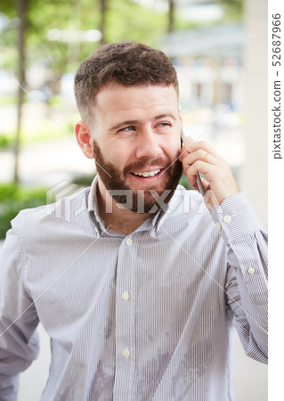 Man talking on the phone outdoors 52687966