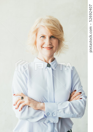 smiling confident business female arms folded ceo smiling confident business female arms folded ceo 52692407