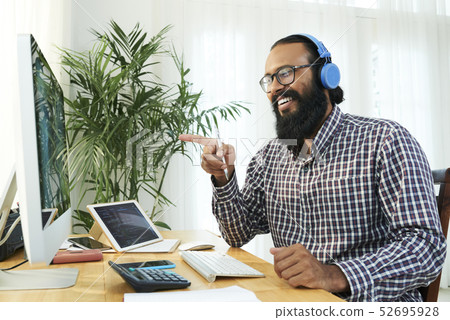 Businessman has online conference on computer Businessman has online conference on computer 52695928