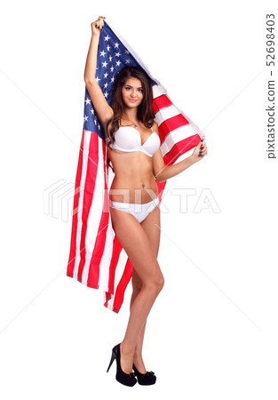 Flag of United States of America in hands of beautiful woman. Isolated image. 52698403