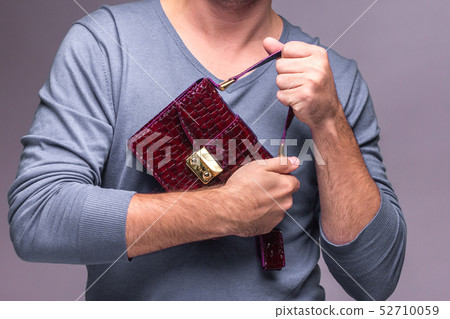 Modern leather bag in hands Modern leather bag in hands 52710059
