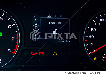 Low Fuel sign on car dashboard. Low Fuel sign on car dashboard. 52711919