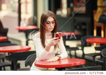 Beautiful brunette woman between palm leaves. Beauty summer make up photo.Close-up selfie-portrait 52717596
