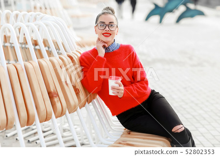 Smiling woman with a cup of coffee - Stock image 52802353