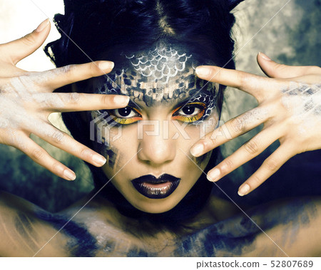 fashion portrait of pretty young woman with creative make up like a snake, halloween concept closeup 52807689