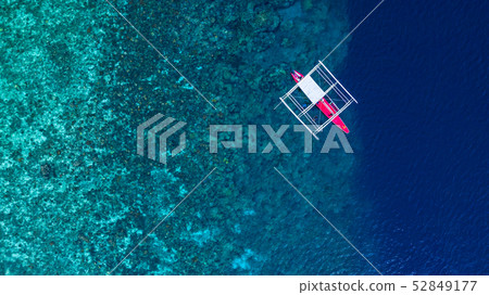 Aerial view of Filipino boats floating on top of 52849177