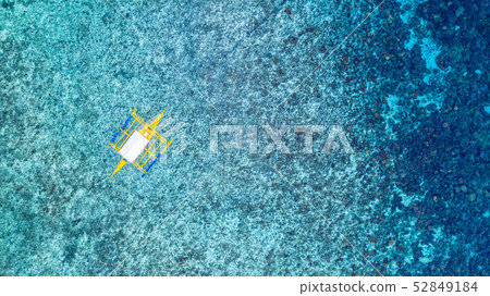 Aerial view of Filipino boats floating on top of 52849184