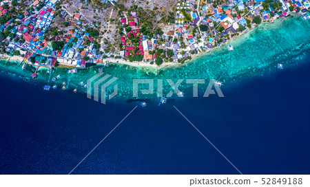 Aerial view of Filipino boats floating on top of 52849188