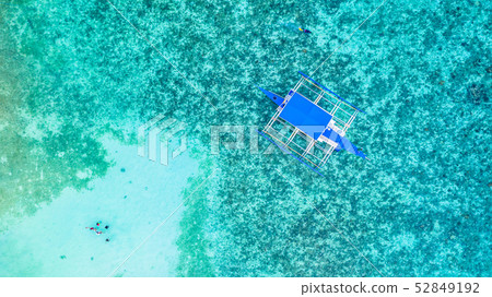 Aerial view of Filipino boats floating on top of 52849192