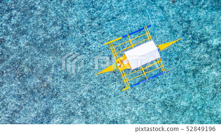 Aerial view of Filipino boats floating on top of 52849196