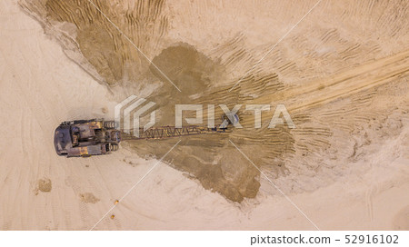 Top down view of excavator in construction site Top down view of excavator in construction site 52916102