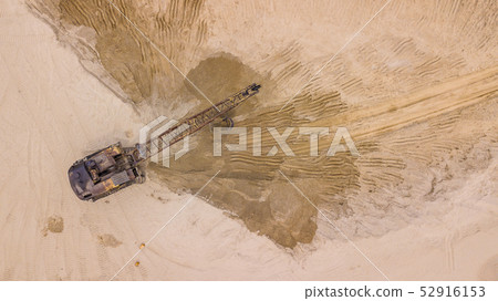 Top down view of excavator working, for costruction site. Top down view of excavator working, for costruction site. 52916153