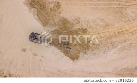 Top down view of digger working, for costruction site. Top down view of digger working, for costruction site. 52916226