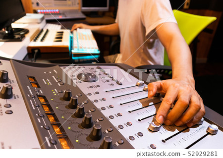 asian male professional producer mixing a song 52929281