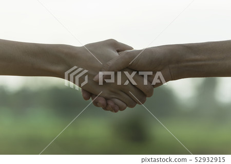 Two hands shaking each other. Teamwork and helping 52932915
