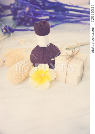 Massage ball and spa aromatherapy product on wood 52956535