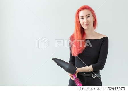 Stylist, hairdresser and people concept - Professional hairdresser with hair dryer on white Stylist, hairdresser and people concept - Professional hairdresser with hair dryer on white 52957975