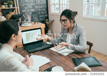 female office workers colleagues arguing at cafe female office workers colleagues arguing at cafe 52958391