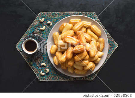 Tulumba - arabian syrup-soaked fried sponge honey  52958508