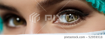Female doctor's face wearing protective mask Female doctor's face wearing protective mask 52959318