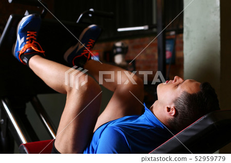 Sporty young man work out legs 52959779