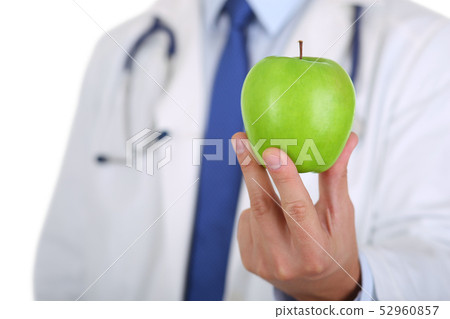 Male medicine therapeutist doctor hands holding green fresh ripe 52960857