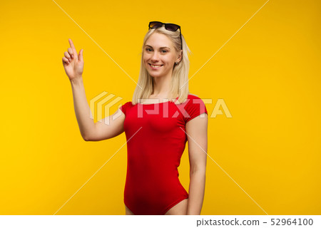 pretty blond lifeguard in red swimsuit and pretty blond lifeguard in red swimsuit and 52964100
