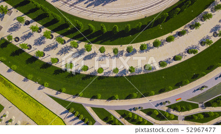 Vertical aerial top down view shot and looking down on the city park in Krasnodar, Russia Vertical aerial top down view shot and looking down on the city park in Krasnodar, Russia 52967477
