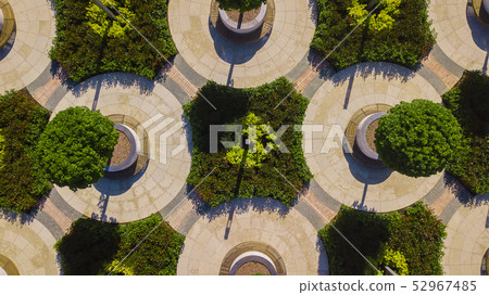 Vertical aerial top down view shot and looking down on the city park in Krasnodar, Russia Vertical aerial top down view shot and looking down on the city park in Krasnodar, Russia 52967485