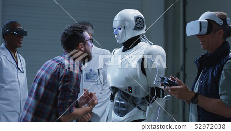 Scientist testing robot with gestures Scientist testing robot with gestures 52972038